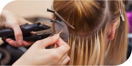 Hair extension installation by professional stylist