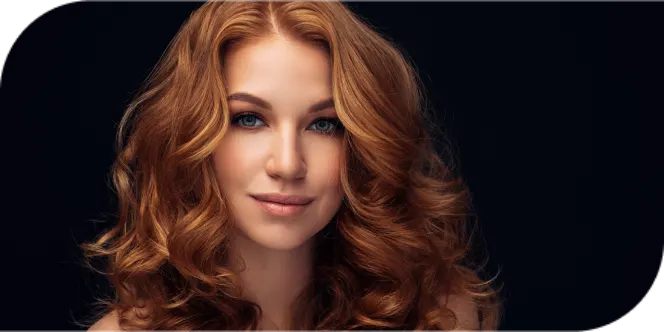 Professional hair styling showcasing vibrant red curly hair