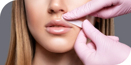 Client receiving professional upper lip wax at beauty salon