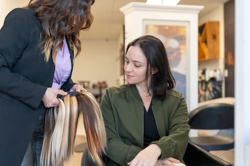 Hair extension consultation at a professional salon